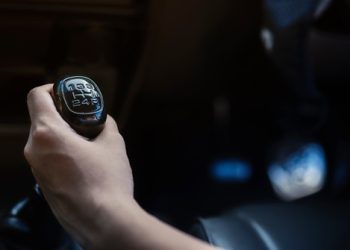 Driver hand shifting gear shift knob manually Driver hand shifting gear shift knob manually